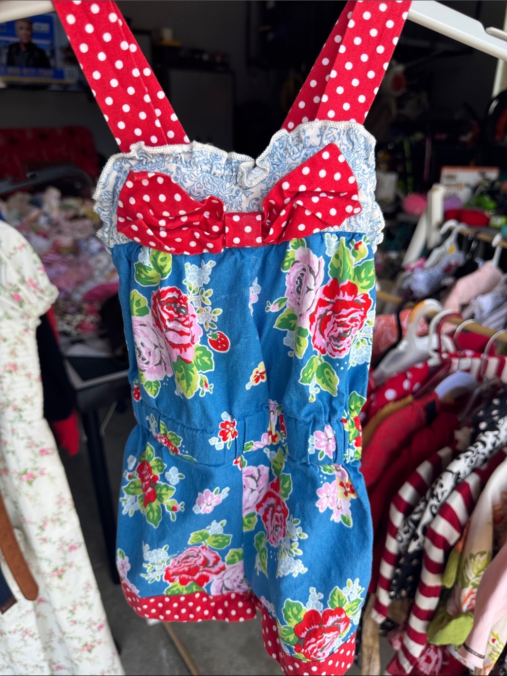 Persnickety Blue Floral Polka Dot Romper with Red Bow.